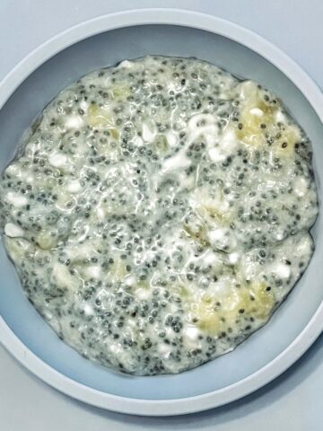 Prepared coconut chia pudding in blue bowl.