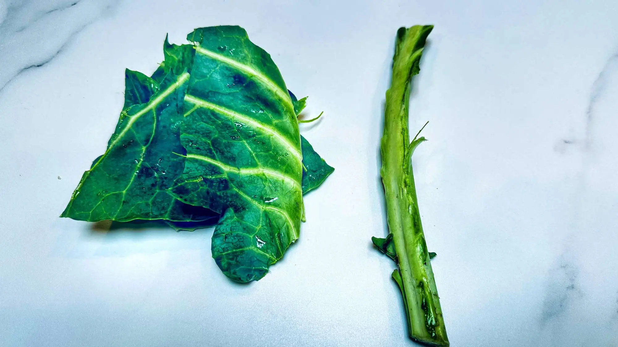 Strawberry Calcium Smoothie. Image of step 1 shredding collard greens.