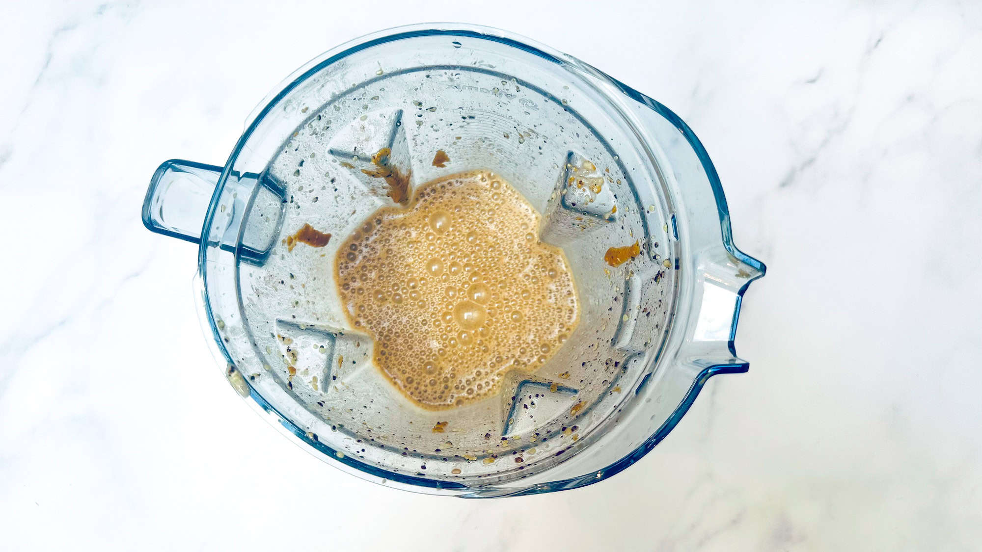 Blending ingredients in a blender for chunky monkey smoothie