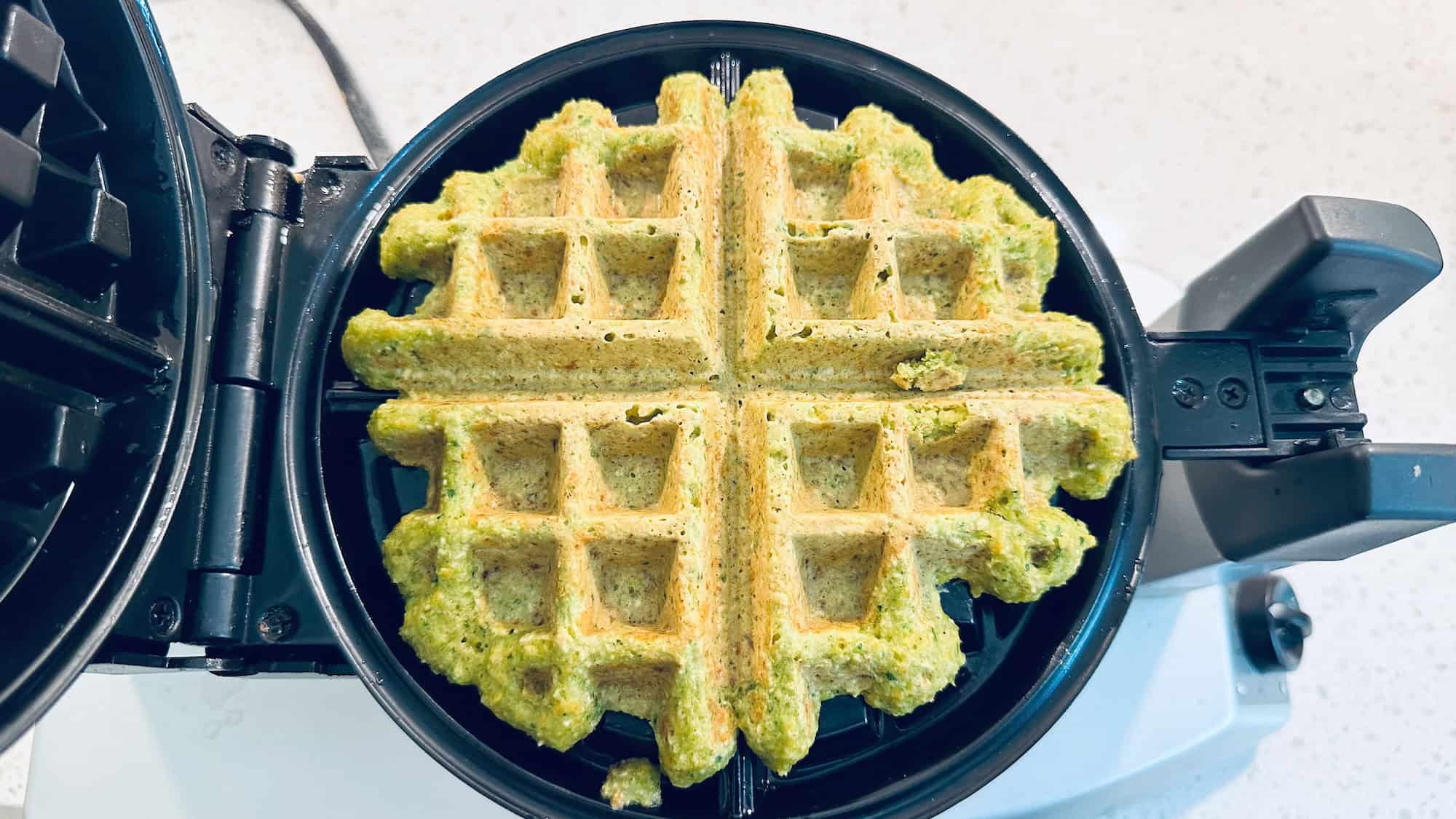 Cooked waffle on waffle pan.