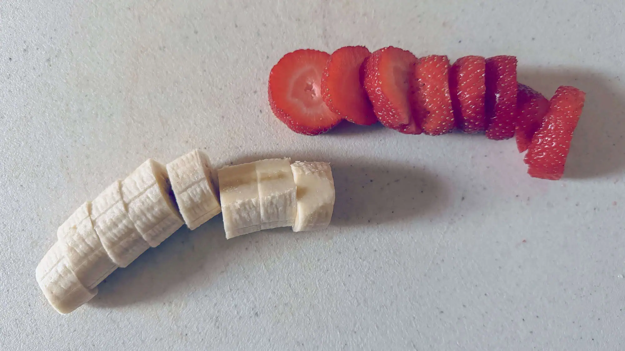 Step 2 for fruit candy canes. Sliced strawberries