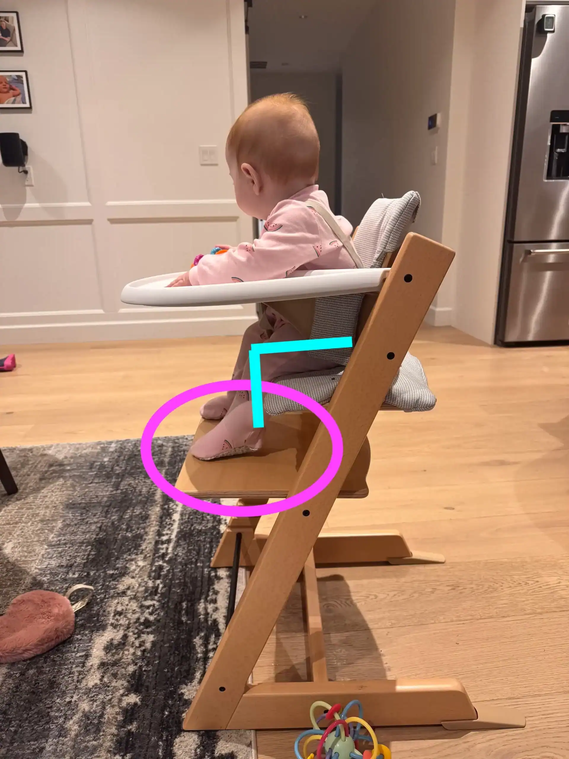 Baby in stokke high chair showing appropriate setup for baby led weaning.