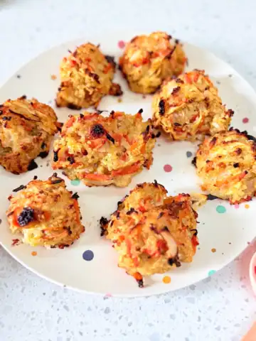Sweet and savoury quinoa egg bites on a polka dot toddler plate.